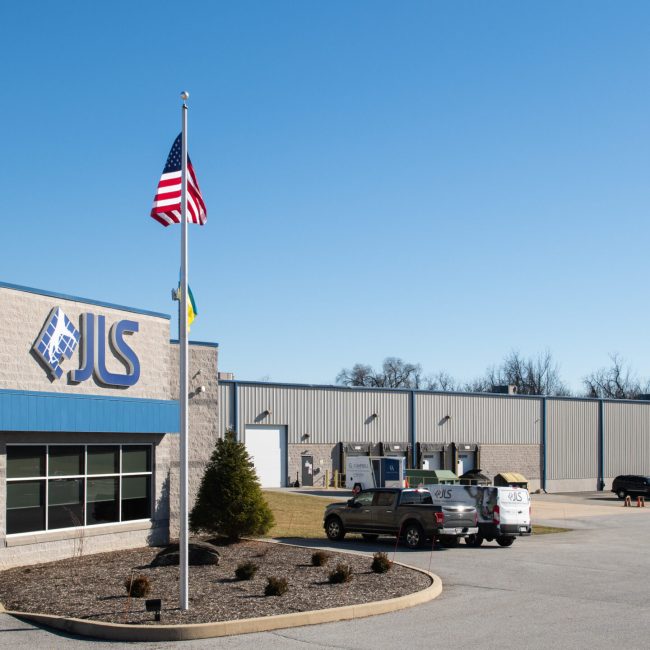 American Flag in front of JLS Automation Main Entrance