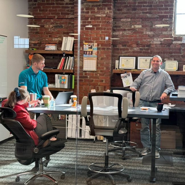 Project collaborators in impromptu meeting