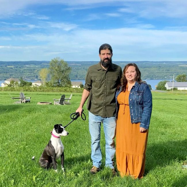 Sarah celebrating 15 year work anniversary with her husband and dog